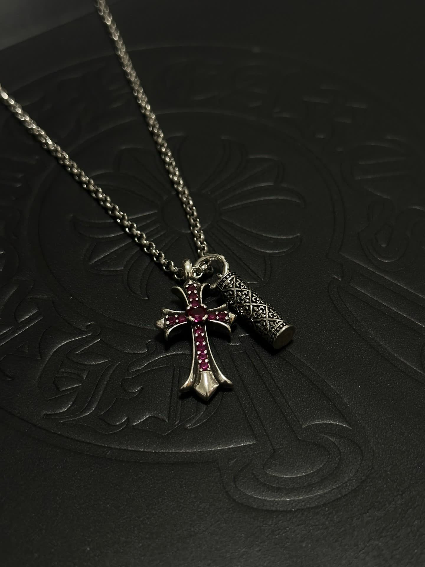 Chrome Hearts Silver Cross Pendant with Ruby Accents and cylindrical charm